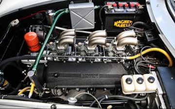 The engine bay of chassis 09051 and its unique three Weber 40 DFI carburetor setup